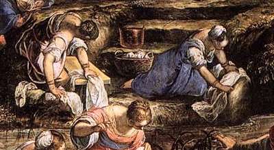 kneeling women scrubbing cloth on rock and board